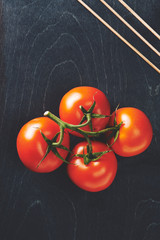 tomatoes on black background