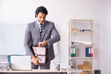 Young handsome businessman employee in the office 