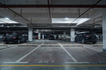 old parking lot with lighting, concrete building