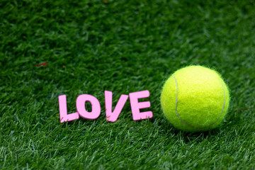 Tennis with love on green grass