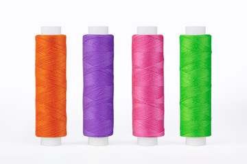 Set of sewing thread coils, miscellaneous colours, isolated on white