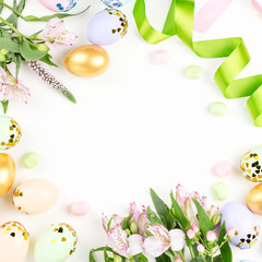 Naklejka na ściany i meble Festive Happy Easter background with decorated eggs, flowers, candy and ribbons in pastel colors on white. Copy space