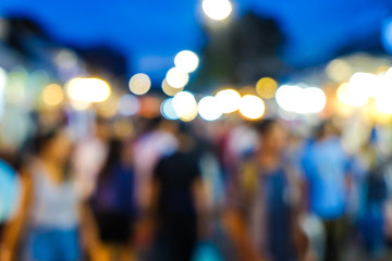 Group of blurred people shopping in outdoor market