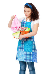 Obraz premium Young housewife with laundry basket, isolated on white background