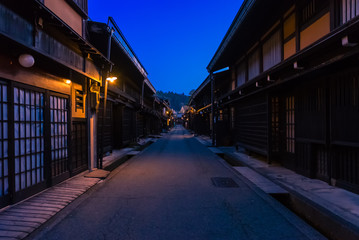 Fototapeta na wymiar Traditional houses in a street of the old city area at twilight, Takayama, Gifu, Japan