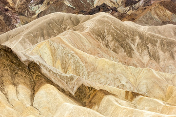 Multicolored background of eroded geological formations in Zabriskie Point, Death Valley national...