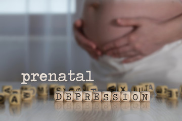 Words  PRENATAL DEPRESSION composed of wooden letters.