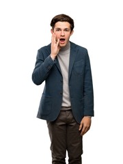 Teenager man with turtleneck with surprise and shocked facial expression over isolated white background