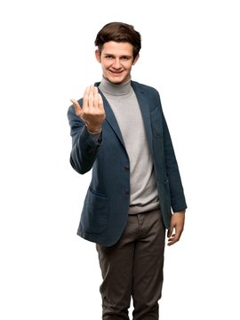 Teenager man with turtleneck inviting to come with hand. Happy that you came over isolated white background