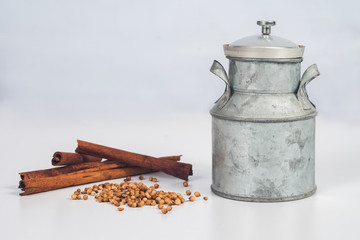 Vintage can with spicy herb on background.