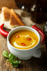 Homemade pumpkin soup with chili pepper
