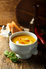 Homemade pumpkin soup with chili pepper