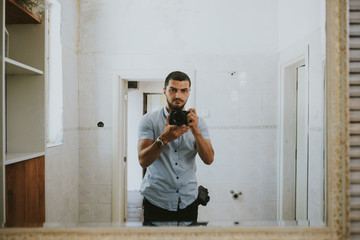 Portrait of a photographer in the mirror