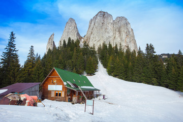hut in rocky mountains, the Lonely Rock formation in Romania. Hasmas
