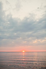 sunset with sun under the sea surface