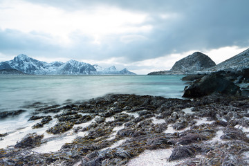 Beautiful sunset near the rocky Haukland beach. Lofoten Islands, Norway
