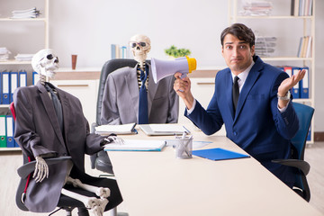 Funny business meeting with boss and skeletons