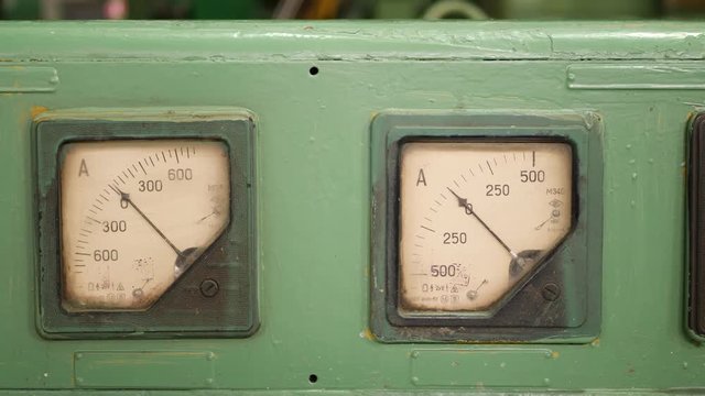 Old retro dusty measuring analogue ampermeter device