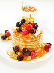 Pancakes with jam and berries