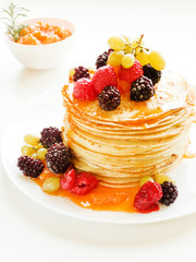Pancakes with jam and berries