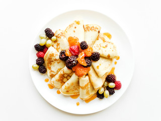 Pancakes with jam and berries