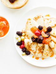 Pancakes with jam and berries