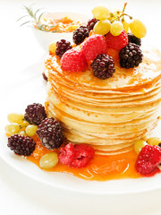 Pancakes with jam and berries