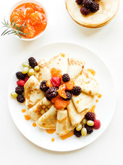 Pancakes with jam and berries