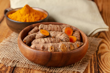 Close up turmeric roots and powder