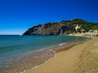 Beautiful sandy beach in Rhodes island, Greece. Vivid colors, summer day light.