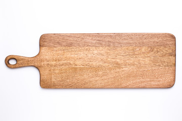 Wooden long kitchen board on a white background top view