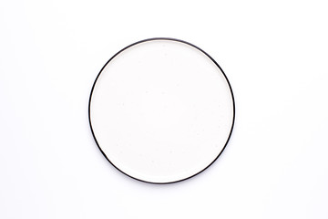 White plate with black border top view