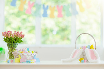 Easter home decoration. Eggs basket and bunny.