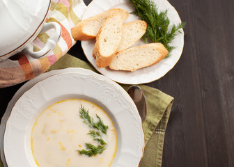 Creamy fish soup with salmon, potatoes, onions and carrots