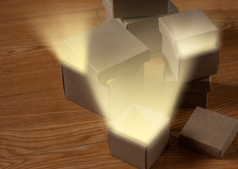Light in a paper box on a wooden table