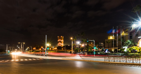 Long Exposure shot of Night Road and car lights Tracks in Rabat, The capital of Morocco with Hassan tower on background