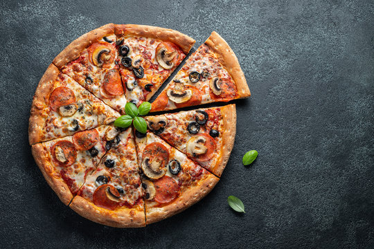 Tasty pepperoni pizza with mushrooms and olives. - Powered by Adobe