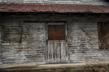Fototapeta na wymiar Door of abandoned building