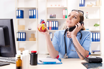 Female doctor cardiologist working in the clinic 