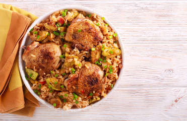 Chicken thighs with rice and zucchini casserole