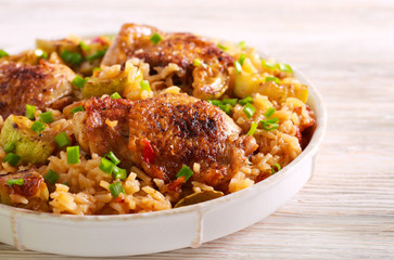 Chicken thighs with rice and zucchini casserole