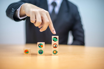 Finger to symbol businessman walking wood blocks shape staircase to climb up career ladder. Personal growth and development process is essential. Concept business motivate employee to growth