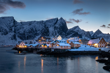 The beautiful Sakrisoy Rorbuer at the Lofoten Islands in Norway in winter and in dusk