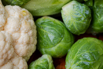 A variety of fresh raw Organic Vegetables including Brussels sprouts, Cauliflowers, Cabbage.