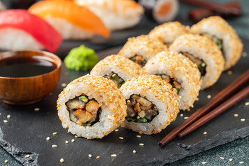 Sushi roll with smoked eel, cucumber, avocado.