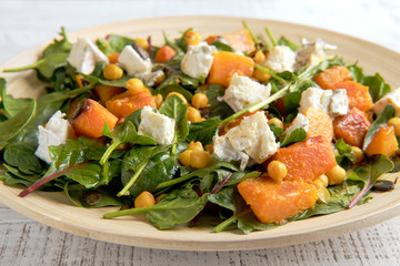 Healthy salad with spinach and pumpkin