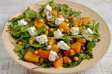 Healthy salad with spinach and pumpkin