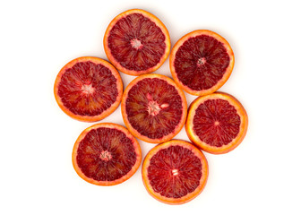 Bloody orange on a white background. Red orange cut into slices on a white background.