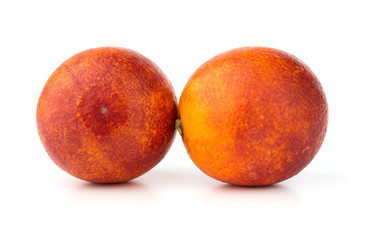 Bloody orange on a white background. Two red orange close-up on a white background.