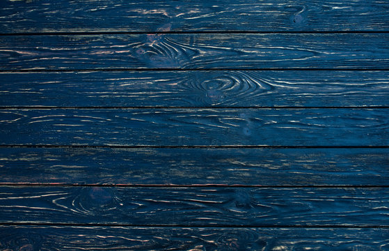 Dark Black Wood Texture Background Viewed From Above. The Wooden Planks Are Stacked Horizontally And Have A Worn Look.